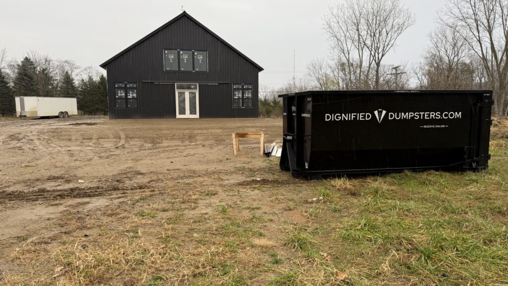 Construction debris loaded into a driveway-friendly dumpster